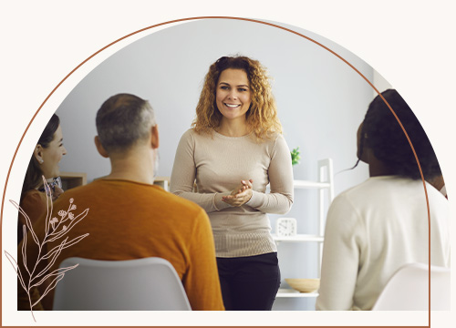 Woman standing up during group therapy